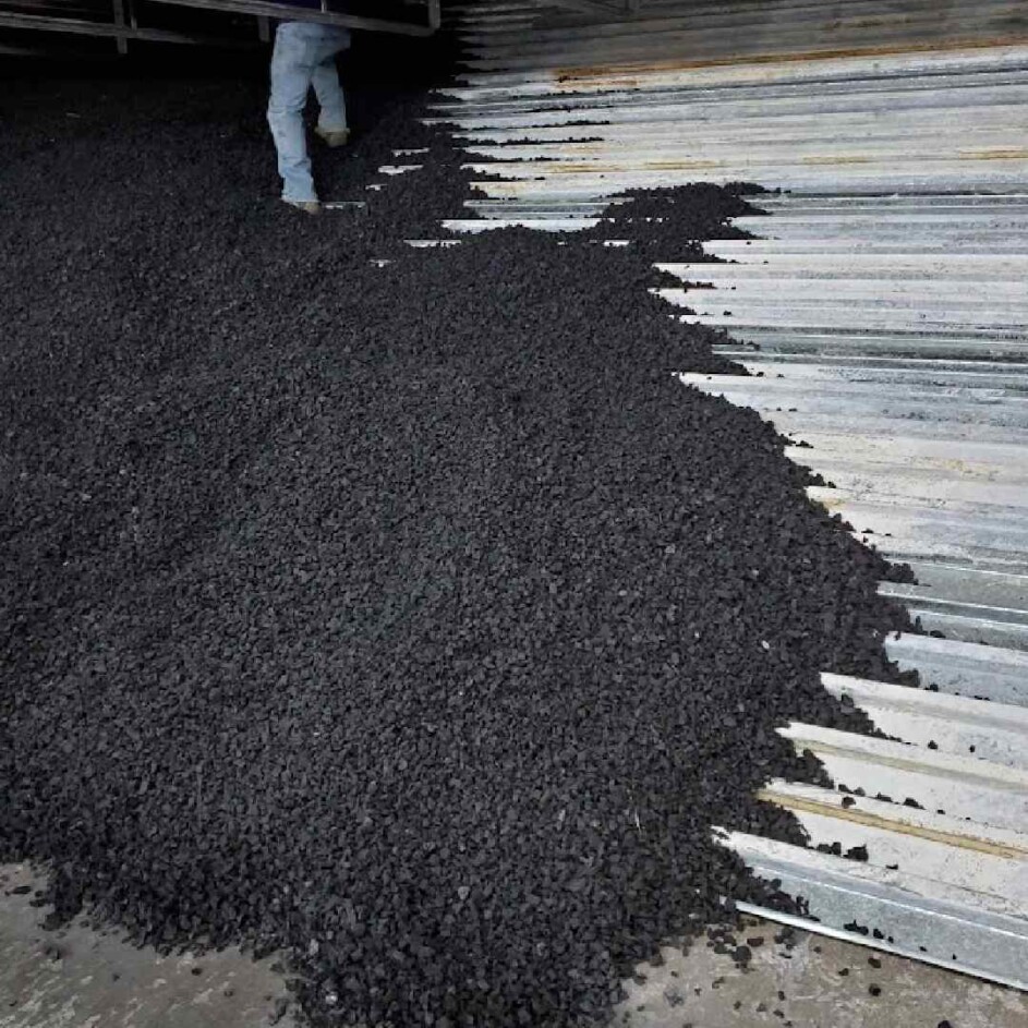 Granulated rubber backstop for gun range